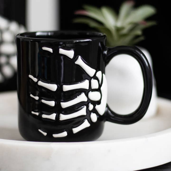 Gothic Halloween Skeleton Hand Mug for wholesale by Something Different Wholesale