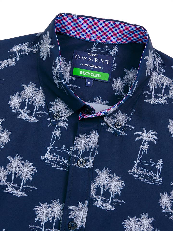 NAVY PALM TREES 4-WAY STRETCH RECYCLED SHORT SLEEVE SHIRT for wholesale on Faire