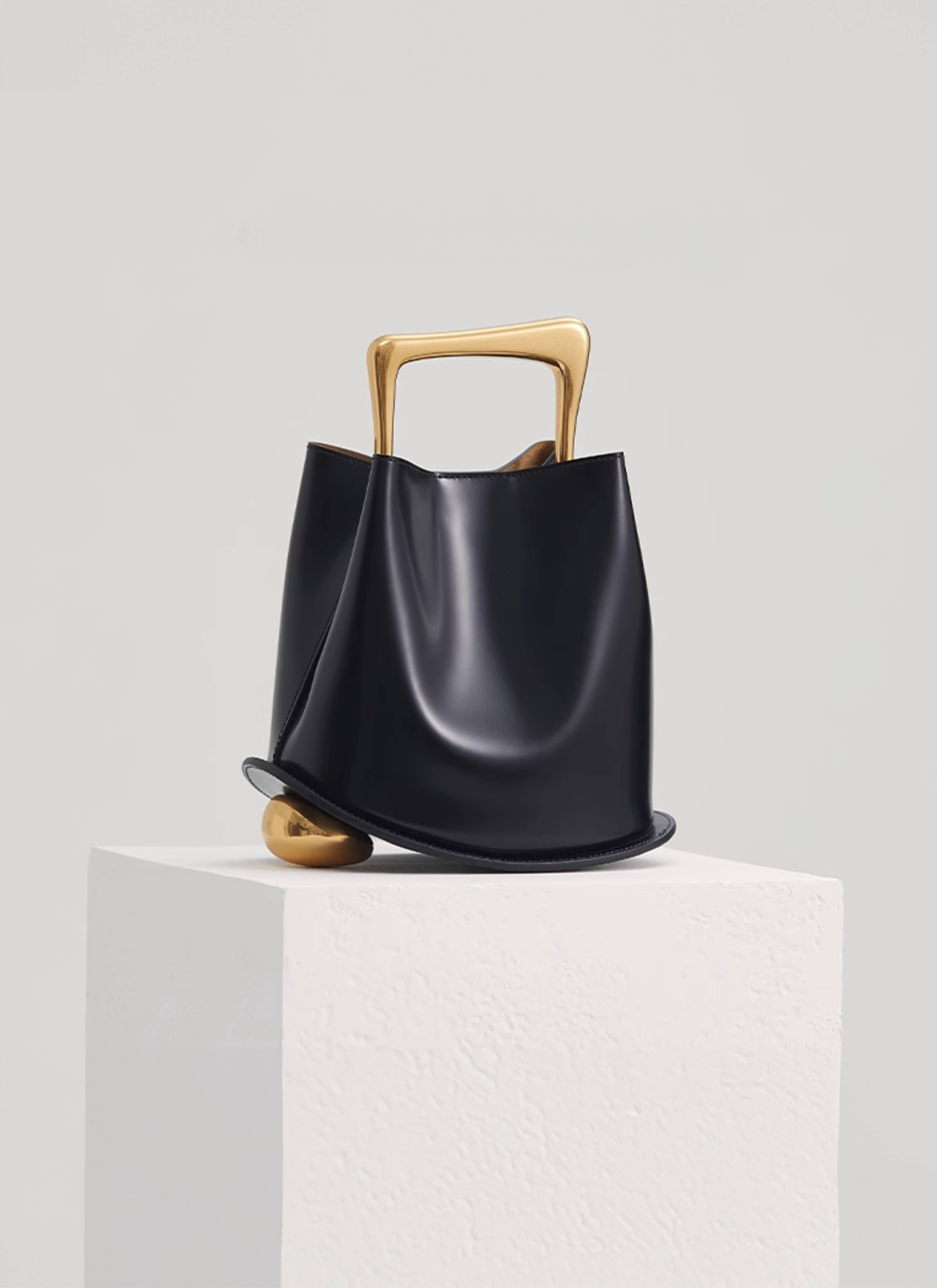 Ozzy Bag - Black & Gold for wholesale on Faire