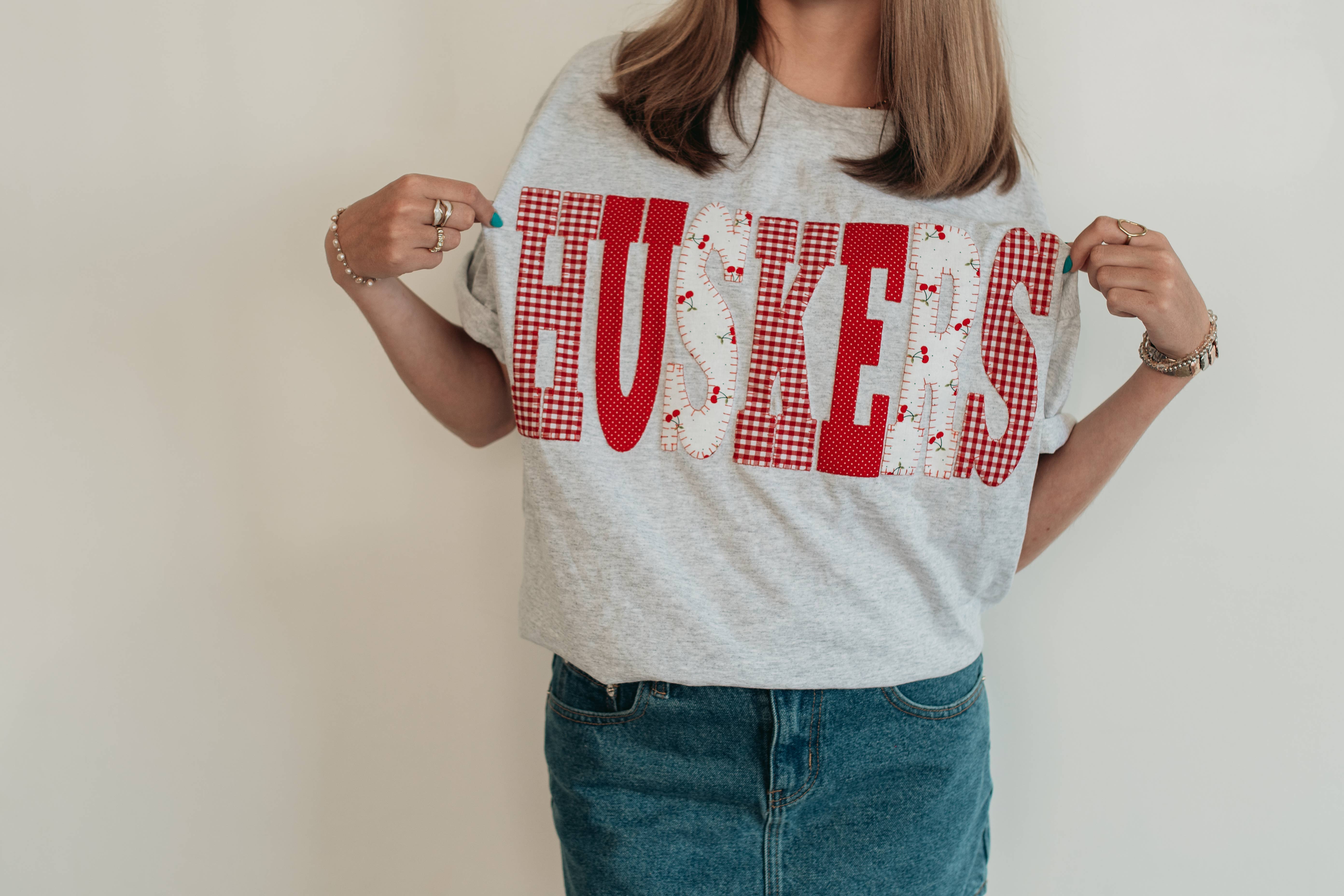 h.flynn - Wholesale T-Shirt - Women's - HUSKERS PATCHWORK TEE - GREY TEE1