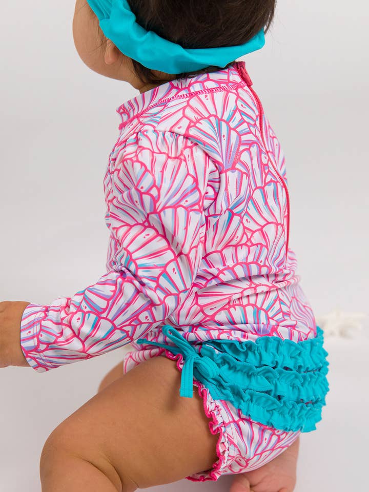 Baby Girls Pink Magical Mermaids Long Sleeve One Piece Rash Guard Swimsuit with Signature Rear Ruffles
for wholesale by RuffleButts + RuggedButts