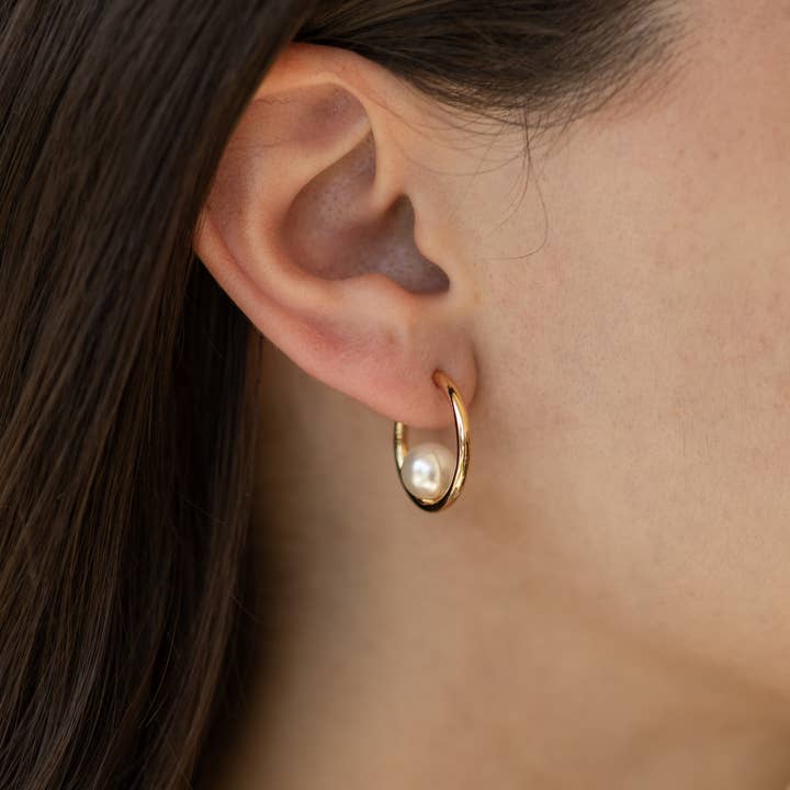 Ada Oversized Pearl Hoop Earrings in Gold for wholesale by The Land of Salt