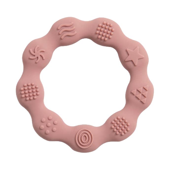 Teether in LFGB silicone with tactile pattern, pink for wholesale by Magni ApS