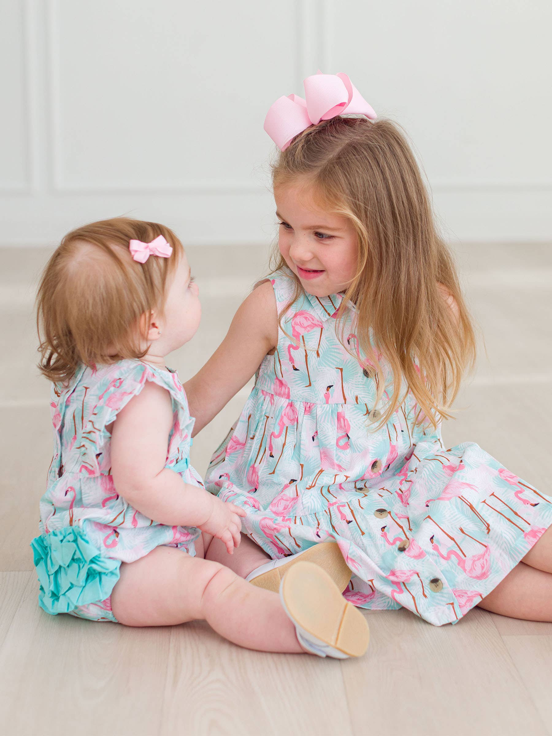 Multi Color Baby Girls Vibrant Flamingo Classic Ruffle Bubble Romper for wholesale on Faire3