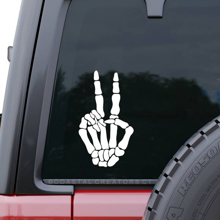 Skeleton Hand Peace Sign Car Window Decal (White, Packaged) for wholesale by Coastal Creators of Connecticut