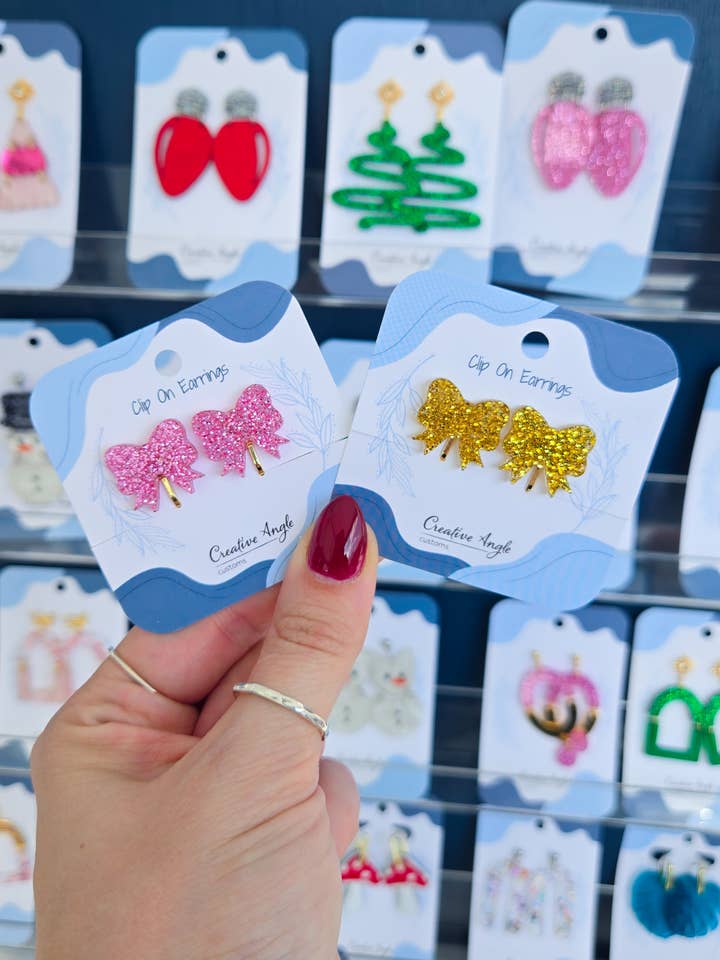 Clip On Glitter Christmas Bow Earrings | Nickel Free for wholesale by Creative Angle Customs