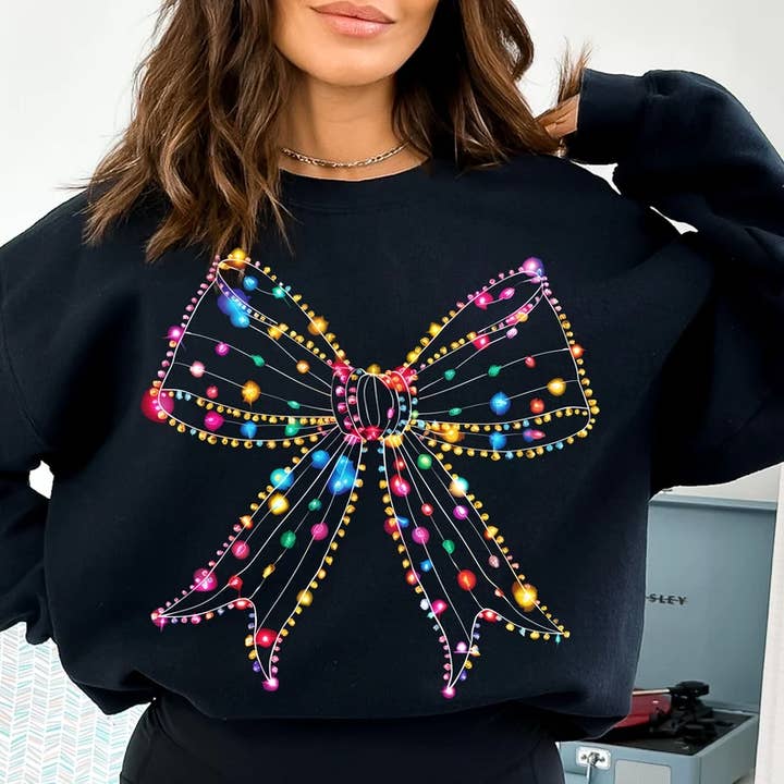 X-MAS LIGHT BOW* CHRISTMAS APPAREL , GRAPHIC CREWNECK for wholesale by Nu Kustomz LLC -