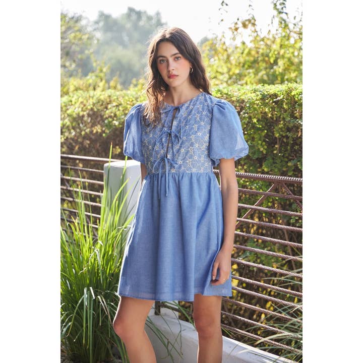 CHAMBRAY EYELET BUST MINI DRESS WITH FRONT BOW TIE DETAIL for wholesale on Faire