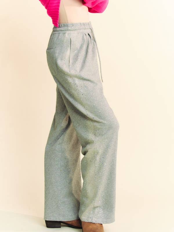 Grigio PANTALONI LUNGHI IN FELPA CON ELASTICO IN VITA CON STRASS in vendita all'ingrosso su Faire