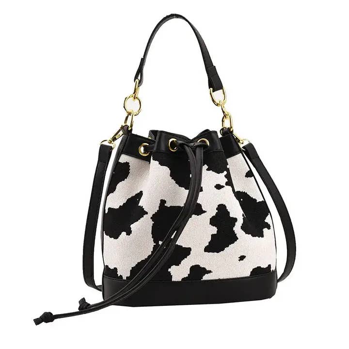 Borsa a Secchiello a Tracolla con Stampa Mucca Chic per la vendita all'ingrosso da parte di Yaya's Luxe Wholesale