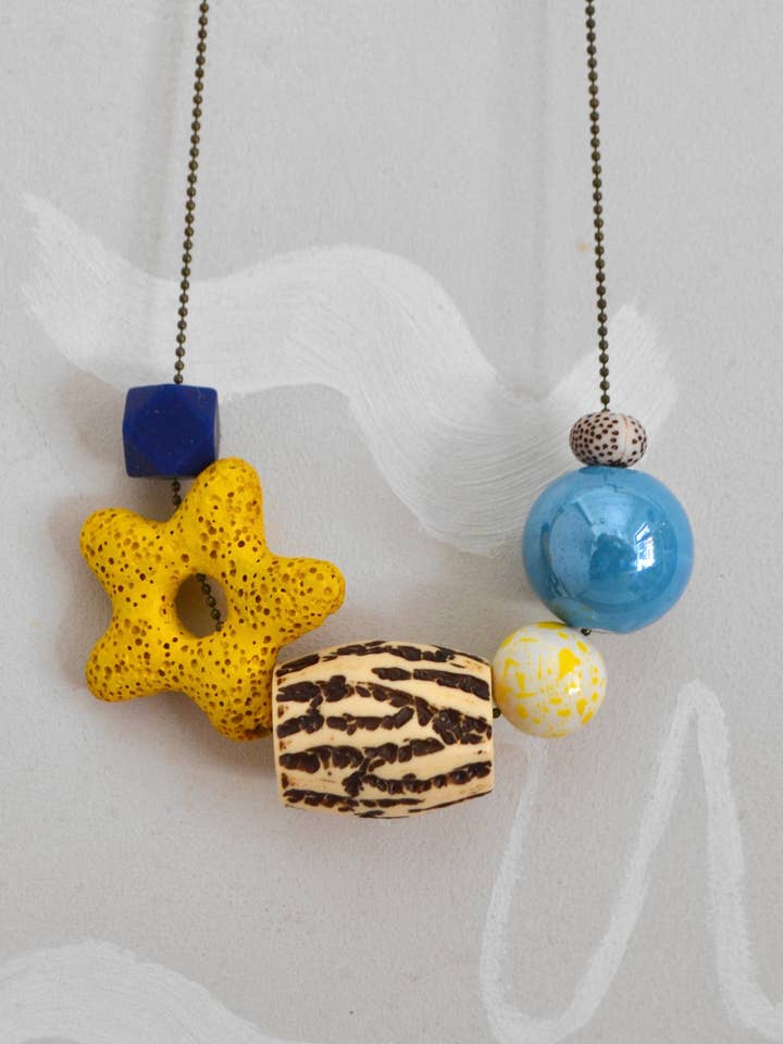 Damesketting keramiek en hout Ster geel voor wholesale door RollitoasÃ