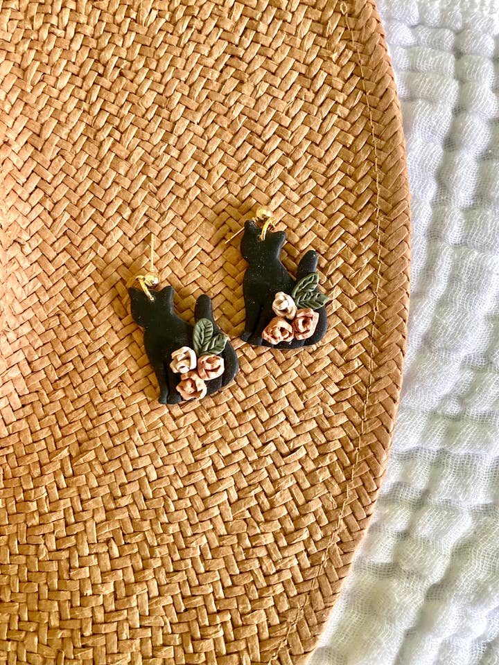 Floral black cat dangle earrings for wholesale by Terra Made