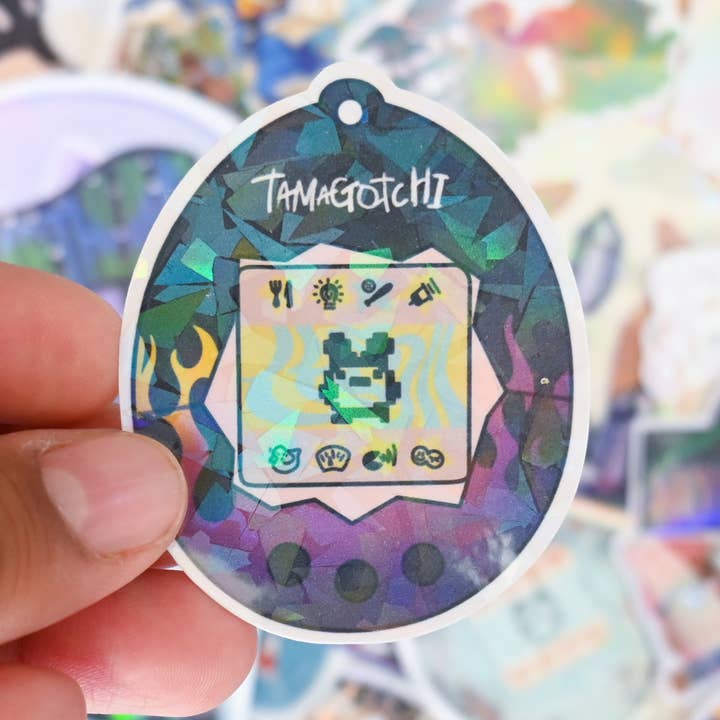 Flames Tamagotchi Sticker for wholesale by Giselle Luna