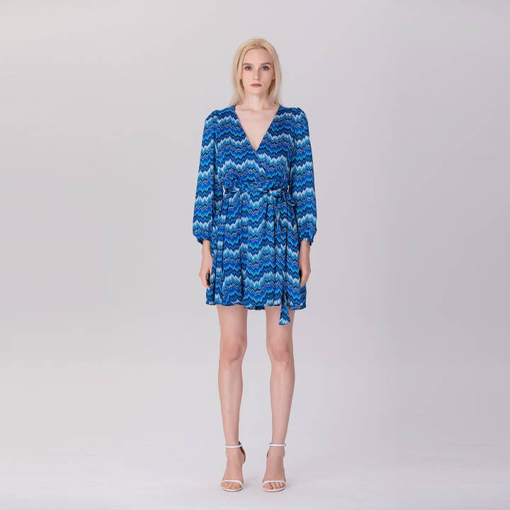 Short printed dress with a V-neck and long sleeves for wholesale by Smart and Joy