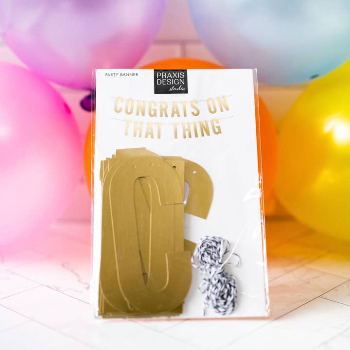 Gefeliciteerd met dat ding feestbanner voor wholesale door Praxis Design Studio