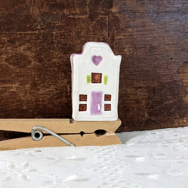 Thumb-sized ceramic white miniature house with purple door for wholesale by CurlyFernCeramics