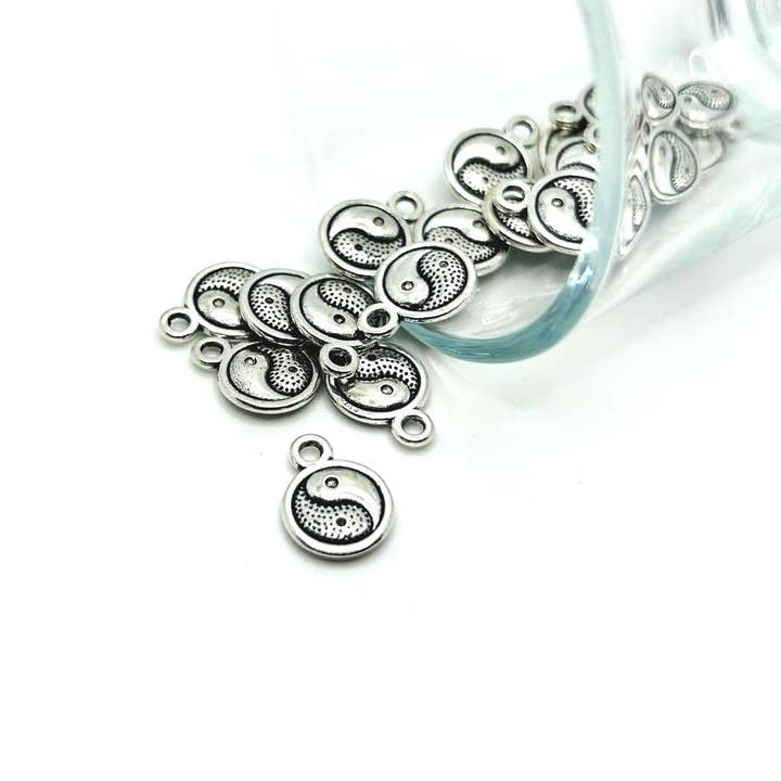 Small Silver Yin Yang Charms, 13x10mm for wholesale by Guerrilla Charm