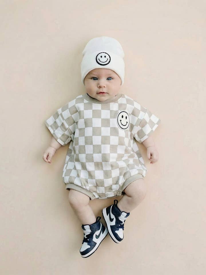 Short Sleeve Bubble Romper | Checkered Smiley Latte for wholesale by Lucky Panda Kids