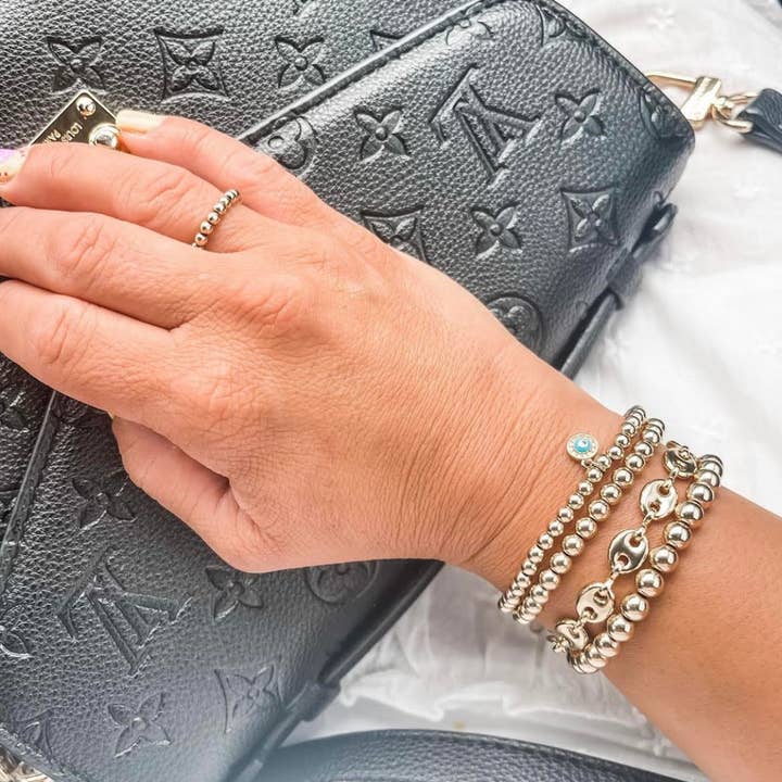 Bella Signature 4-mm-Goldperlenarmband mit Evil Eye-Anhänger für den Großhandel von Bella Rose & Co