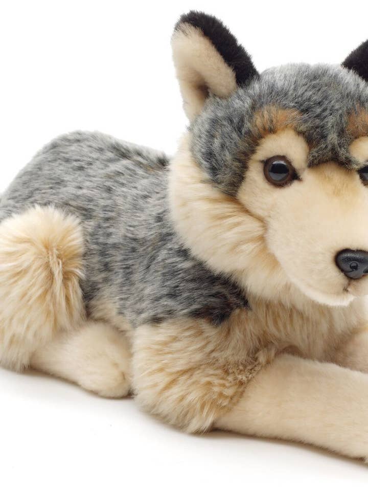 Grey wolf, lying down - 30 cm (length) - cuddly/plush toy for wholesale by Uni Toys