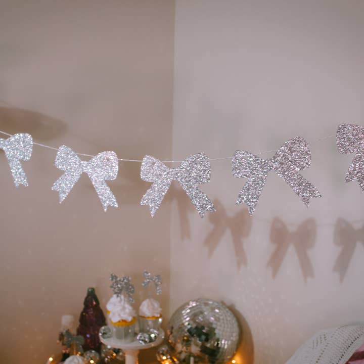 Bannière de vacances à nœud à paillettes argentées pour la vente par Ninalem's Party