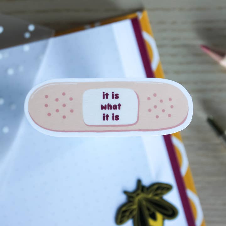 It Is What It Is Band-Aid - Waterproof Die-cut Sticker and other Purchase Wholesale die buchhandlerin band 3. Free Returns & Net 60 Terms on Faire trending on Faire.
