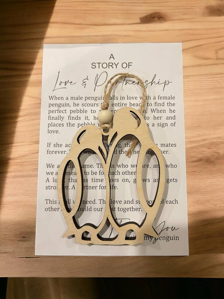 Penguin Love Story Ornament - 1/4 Inch Wooden Couple Keepsake for wholesale by Montgomery and Claire