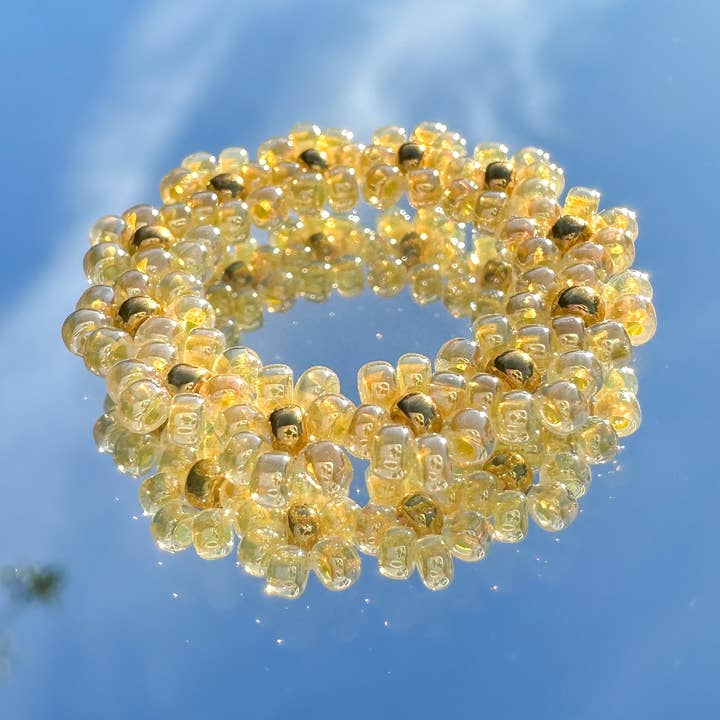 Flower ring "Lilly" made of glass beads in butter yellow for wholesale by cool people club