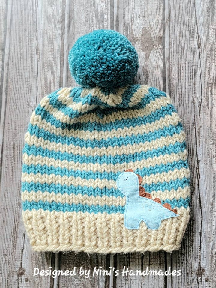 Hand Knit Beige and Smoky Turquoise striped Pom Pom Hat for wholesale by Nini's Handmades