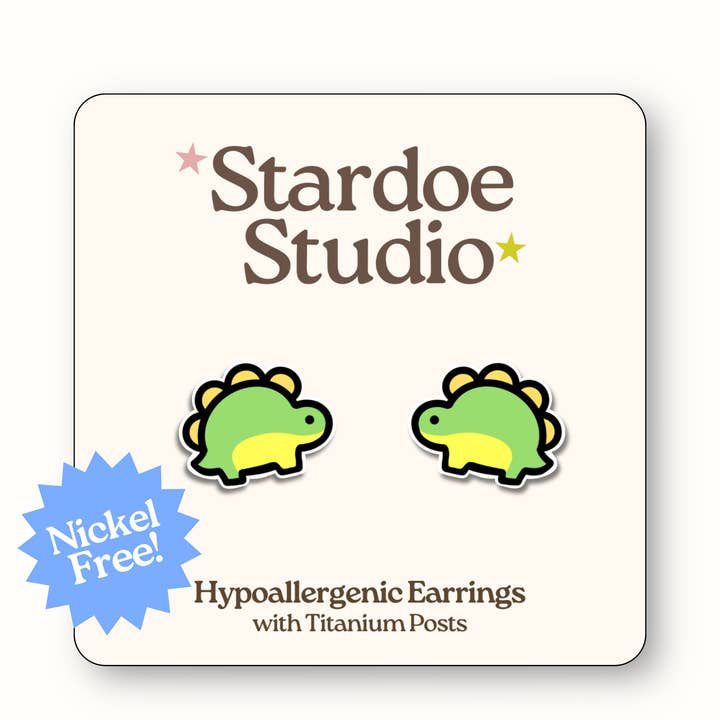 Orecchini a forma di dinosauro verde per la vendita all'ingrosso da parte di Stardoe Studio