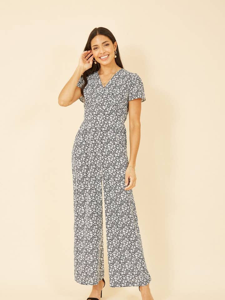 Yumi Black Ditsy Floral Wrap Jumpsuit for wholesale by Yumi