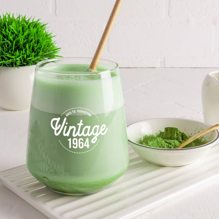 Vintage 1964 Stemless Wine Glass for Women (14 oz, 1 count) for wholesale by On The Rox Drinks