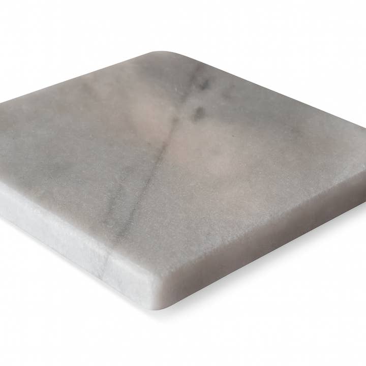 Kalu Creations - Wholesale Coasters - Set of 4 square coasters in white Carrara marble 10x10 cm. Elegant and natural, perfect for protecting tables and surfaces. Italian craftsmanship, stain and scratch resistant.