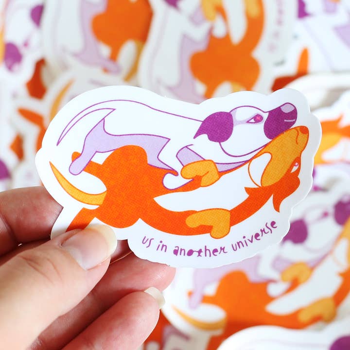 "Us in Another Universe" Cute Dog Cuddling Sticker for wholesale by By Danielle Witten