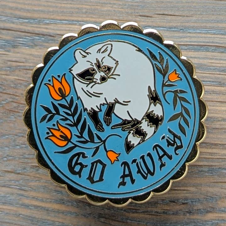 Go Away Raccoon Hex Sign Gold Hard Enamel Pin for wholesale by Thistle Finch Designs
