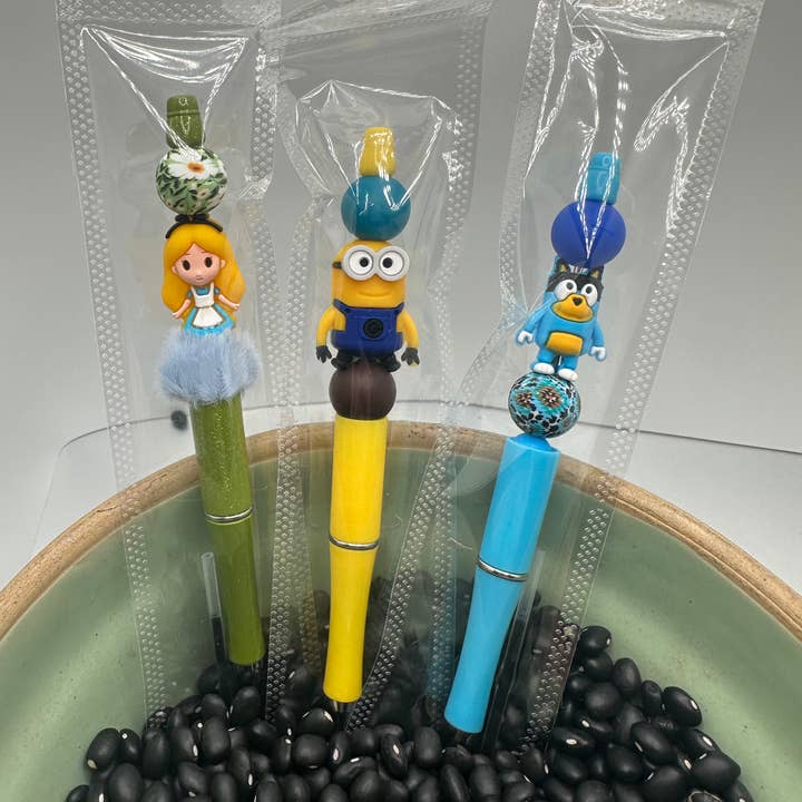 Penna con personaggio super trendy in silicone con perline e ricarica. per la vendita all'ingrosso da parte di Crooked Halo