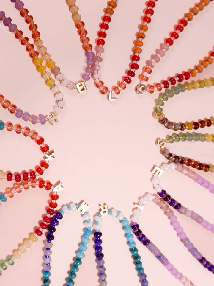 MINI INITIAL MULTI COLOR BEADED NECKLACE | 80N901 for wholesale by JOSSLYN by wall to wall