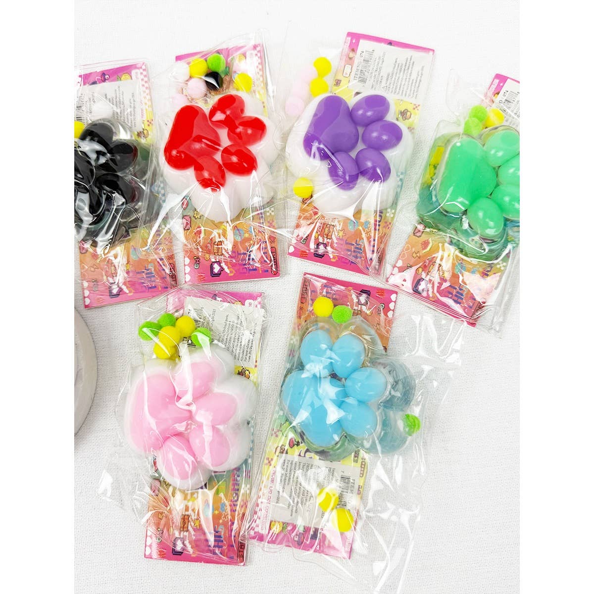 MIX COLOR Addicting Paw Pinch Squishy Toy for wholesale on Faire3