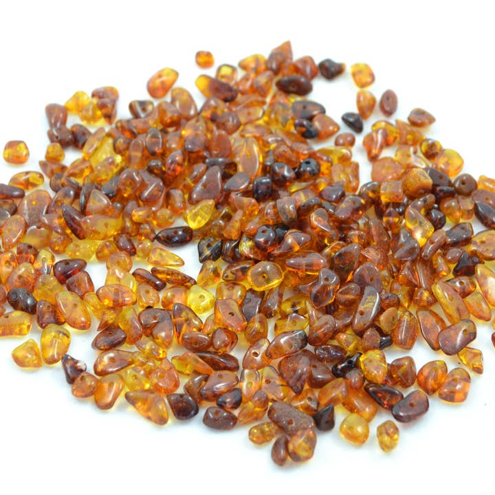 Losse cognackleurige gepolijste barnsteen splitklare kralen voor wholesale door The Natural Amber
