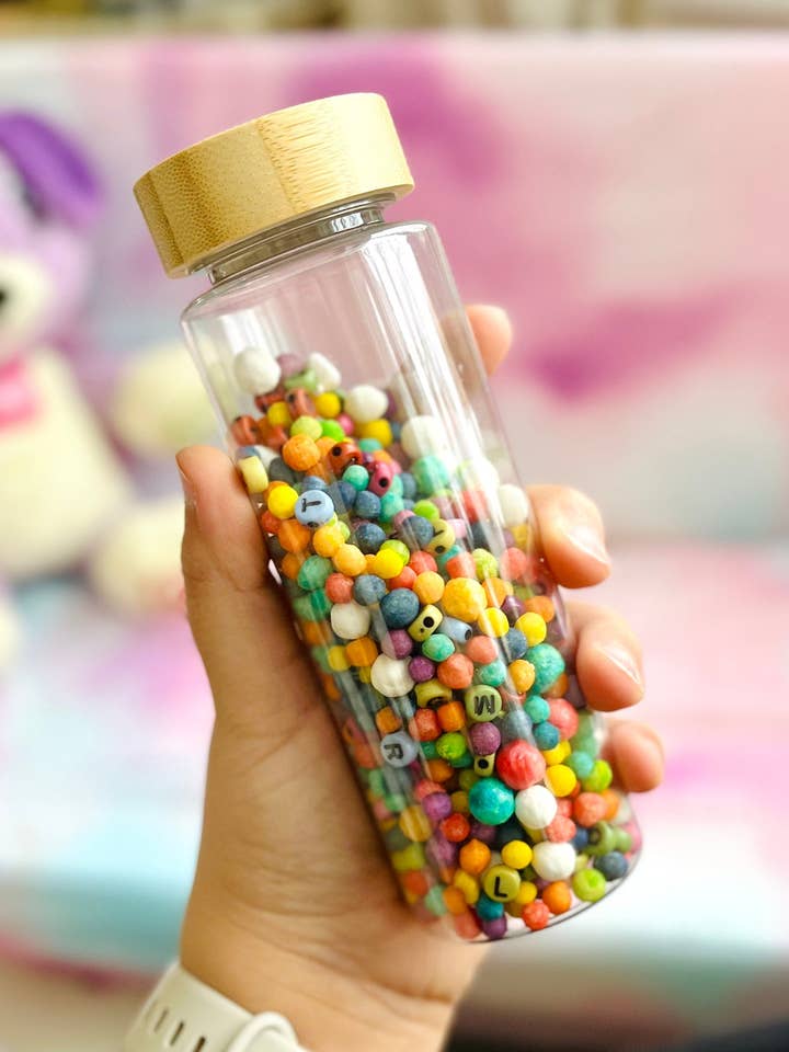 Rainbow Sensory Montessori Fidget Bamboo Bottle for wholesale by Happy Little Sprouts