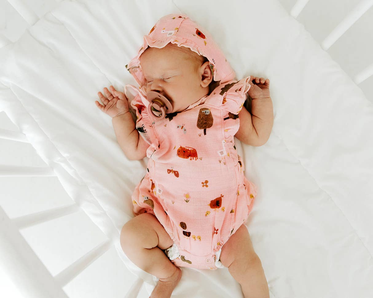 Blush Farm Ruffle Criss Cross Short Baby Romper (Organic Muslin) for wholesale on Faire1