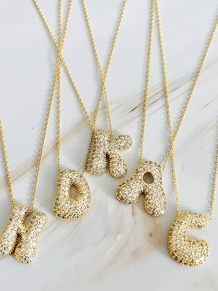 Crystal Bubble Initial Necklace and other Purchase Wholesale rhinestone letters. Free Returns & Net 60 Terms on Faire trending on Faire.