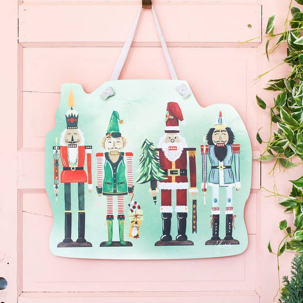 Festive Nutcracker Door Hanger for wholesale by Songbird Grove Collection