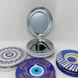 Purchase Wholesale evil eye mirror. Free Returns & Net 60 Terms on Faire