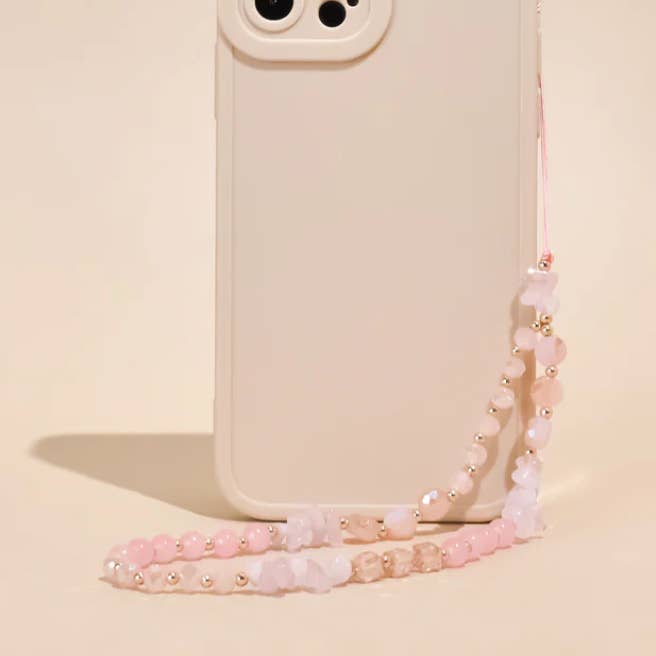 Telefonrem med perler - lyserød og guld for engroshandel hos Coconut Lane