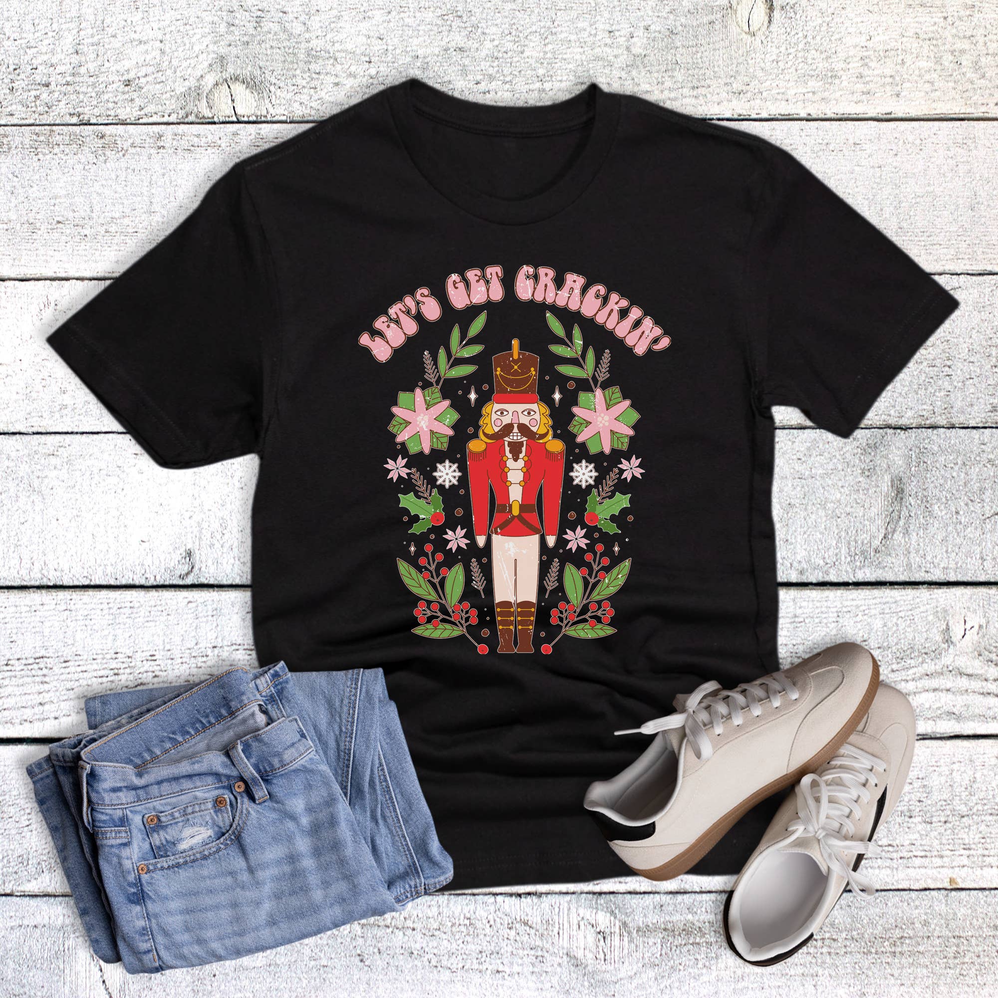 Black Christmas Holly Let's Get Crackin' Graphic Tee for wholesale on Faire0