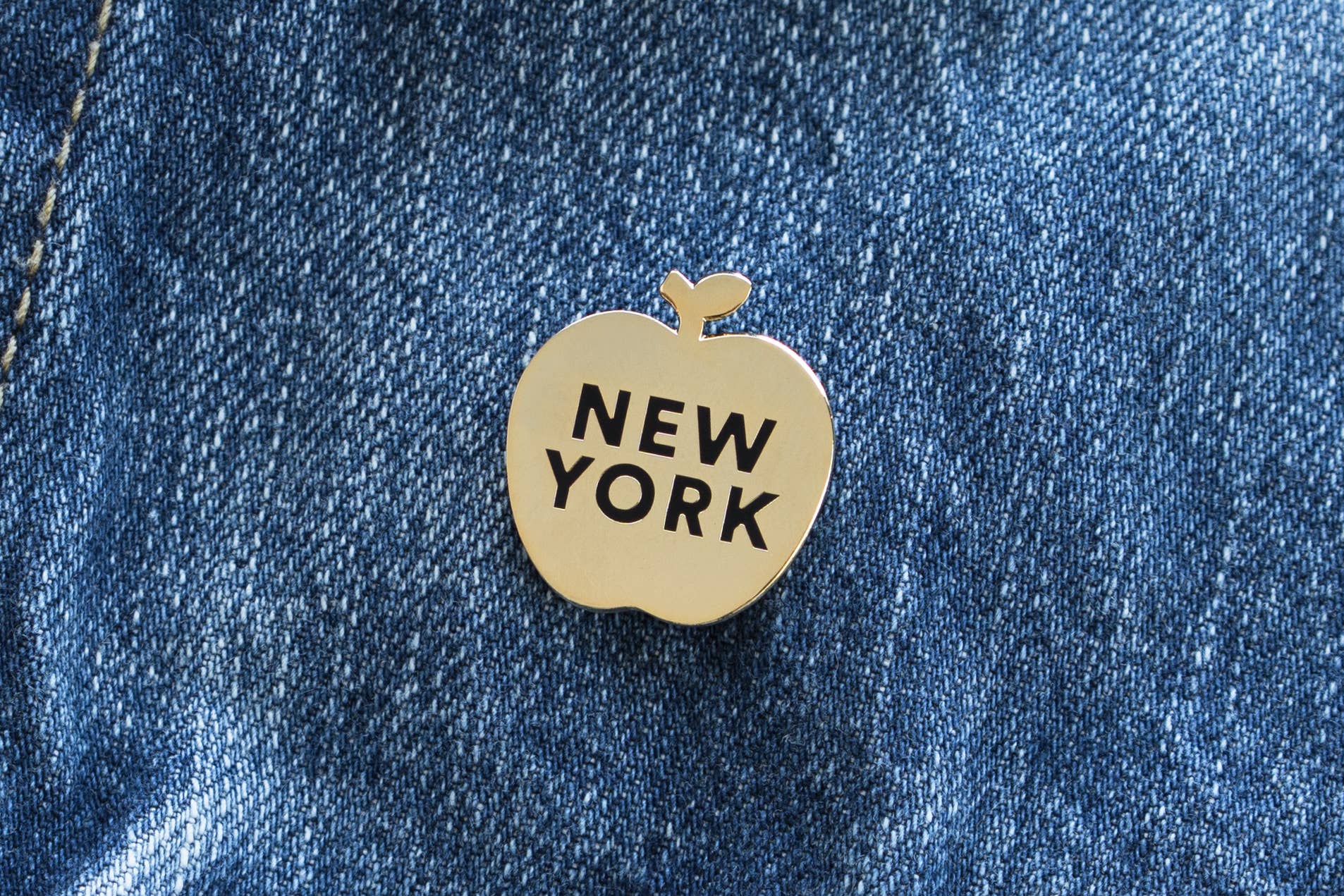 Gold black New York Apple Pin for wholesale on Faire0