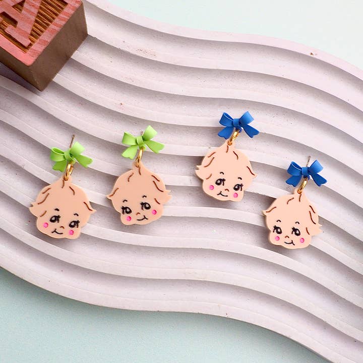 Kewpie Baby Bow kitsch earrings for wholesale by Rosamond Street