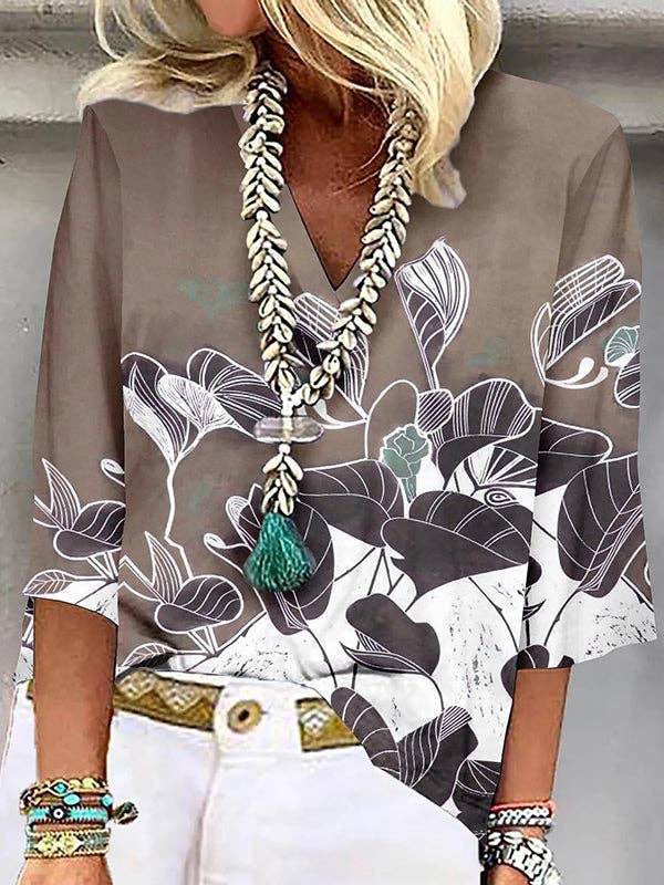 UZ Wholesale Store - Vendita all'ingrosso Camicetta - Donna - T-shirt larghe con scollo a V con stampa floreale e maniche a tre quarti3