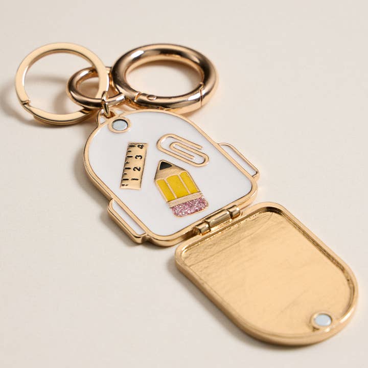 IV Gold Backpack Locket Keychain with School Supply Icons for wholesale on Faire1